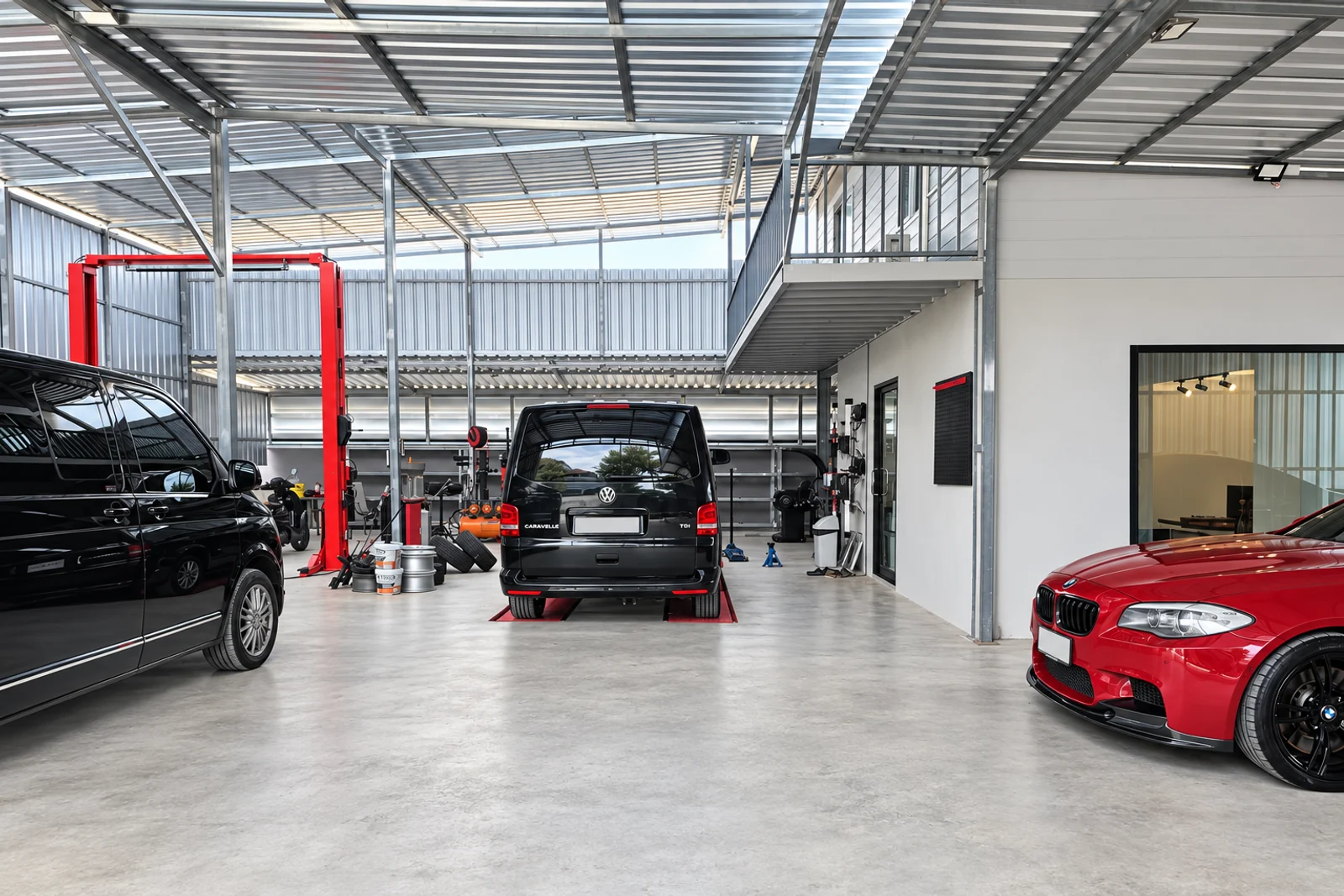 Garage SOI 5 workshop with service bays, vans and a red car